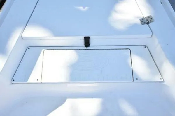 Slide: The Image of 2018 Sportsman Tournament 214 Bay Boat deck with storage compartment. - 25