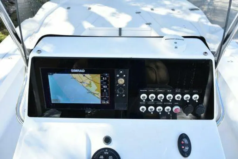 Slide: The Image of 2018 Sportsman Tournament 214 Bay Boat dashboard with navigation system and control panel. - 30