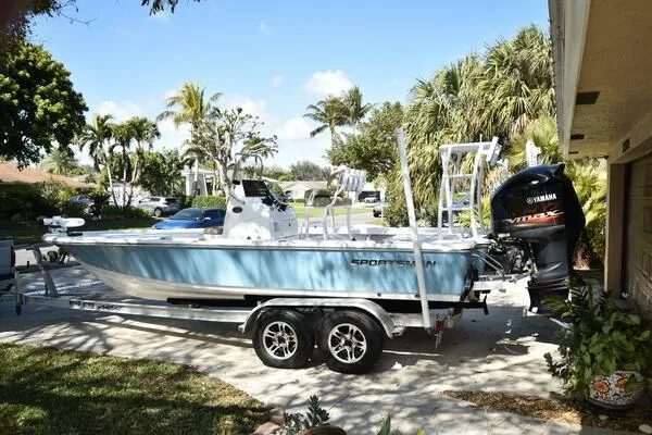 Slide: The Image of 2018 Sportsman Tournament 214 Bay Boat on trailer, parked in sunny driveway. - 36
