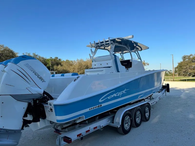 Slide: The Image of 2018 Concept 392 Family Edition boat on trailer, featuring twin Mercury engines. - 14