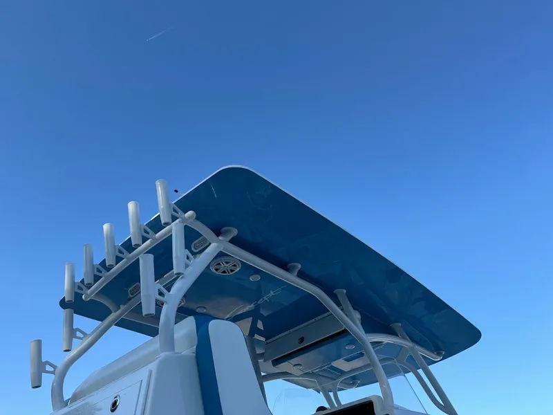 Slide: The Image of T-top of 2018 Concept 392 Family Edition boat against clear blue sky. - 17