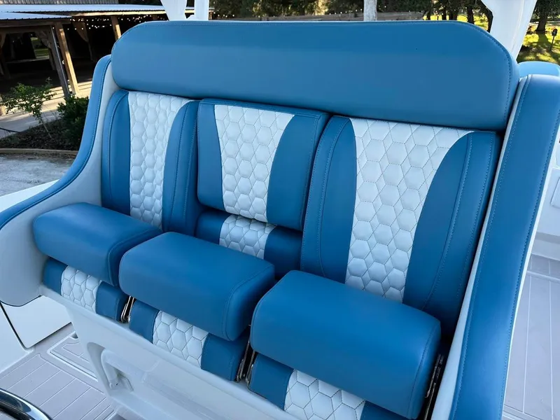 Slide: The Image of Blue and white seating in 2018 Concept 392 Family Edition boat. - 28