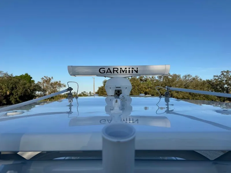 Slide: The Image of Garmin radar on 2018 Concept 392 Family Edition boat, clear sky background. - 33
