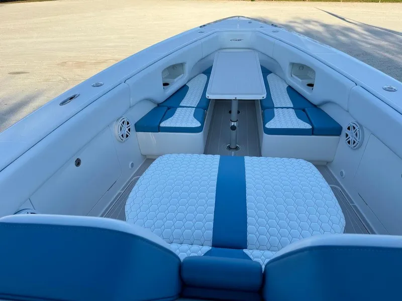 Slide: The Image of 2018 Concept 392 Family Edition boat interior with blue and white seating and table. - 36