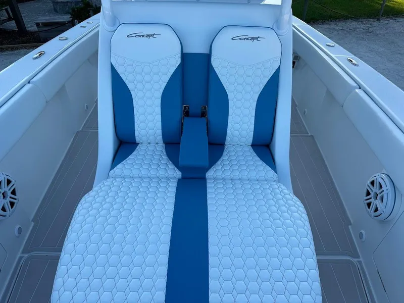 Slide: The Image of Luxurious seating on 2018 Concept 392 Family Edition boat, featuring blue and white upholstery. - 37