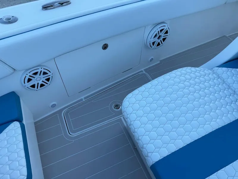 Slide: The Image of 2018 Concept 392 Family Edition boat interior with blue and white seating and speakers. - 38