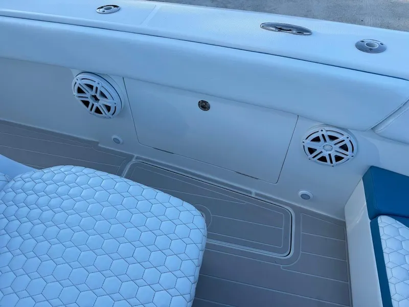 Slide: The Image of Interior of 2018 Concept 392 Family Edition boat with white seating and speakers. - 39
