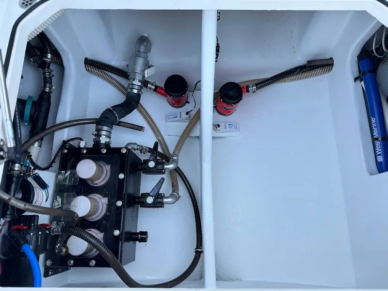 Slide: The Image of Engine compartment of 2018 Concept 392 Family Edition boat, showcasing hoses and mechanical components. - 41