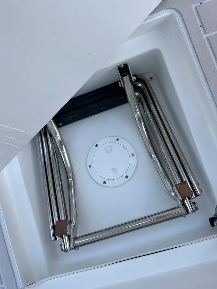 Slide: The Image of Foldable ladder in storage compartment of 2018 Concept 392 Family Edition boat. - 47