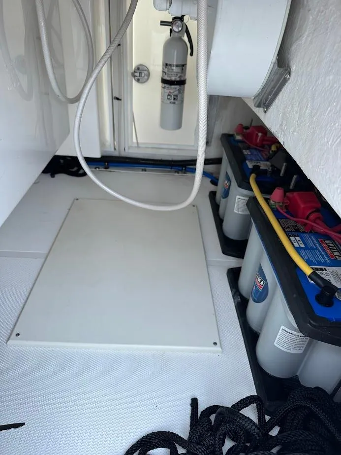 Slide: The Image of 2018 Concept 392 Family Edition boat interior with batteries and fire extinguisher. - 49