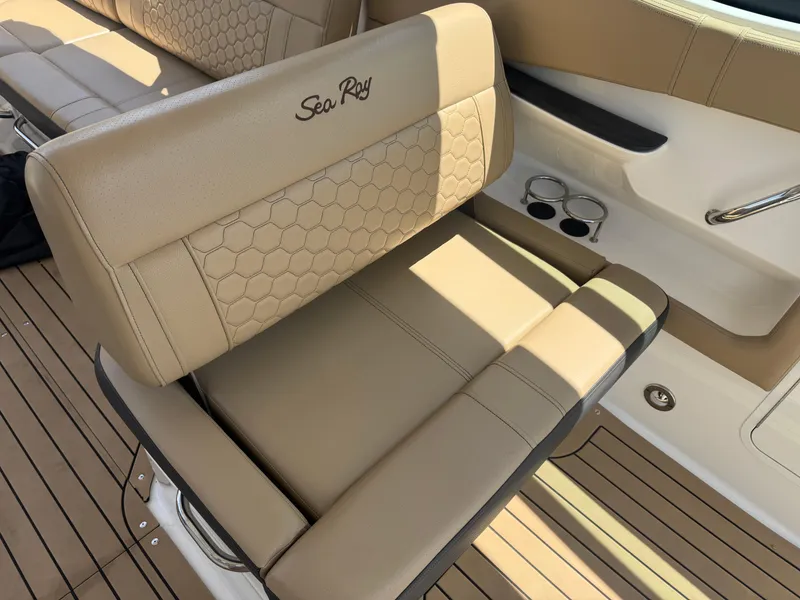Slide: The Image of Luxury seating on 2021 Sea Ray Sundancer 320 Coupe Outboard boat, featuring tan upholstery. - 19
