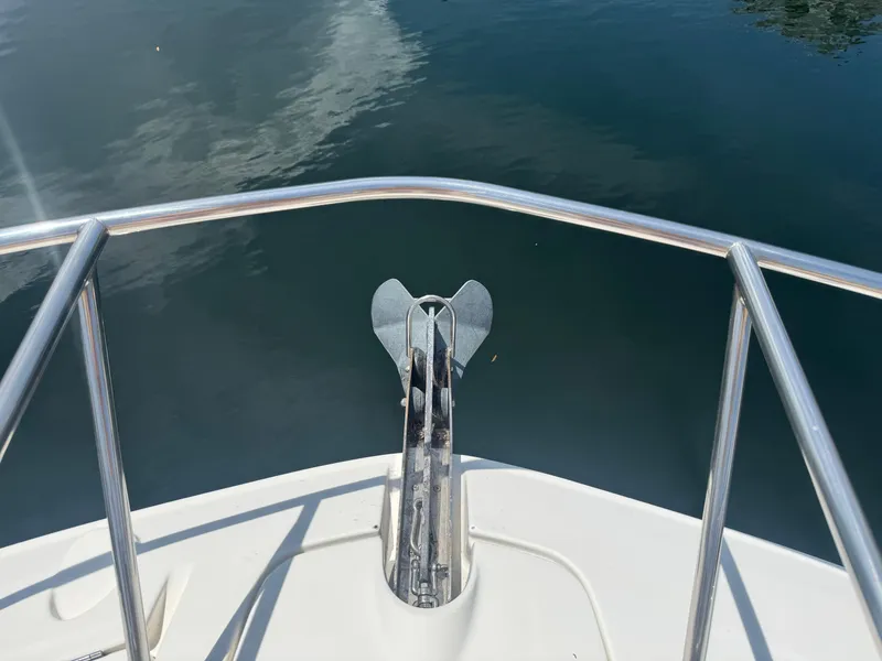 Slide: The Image of Bow view of 2021 Sea Ray Sundancer 320 Coupe Outboard with anchor and railing. - 23