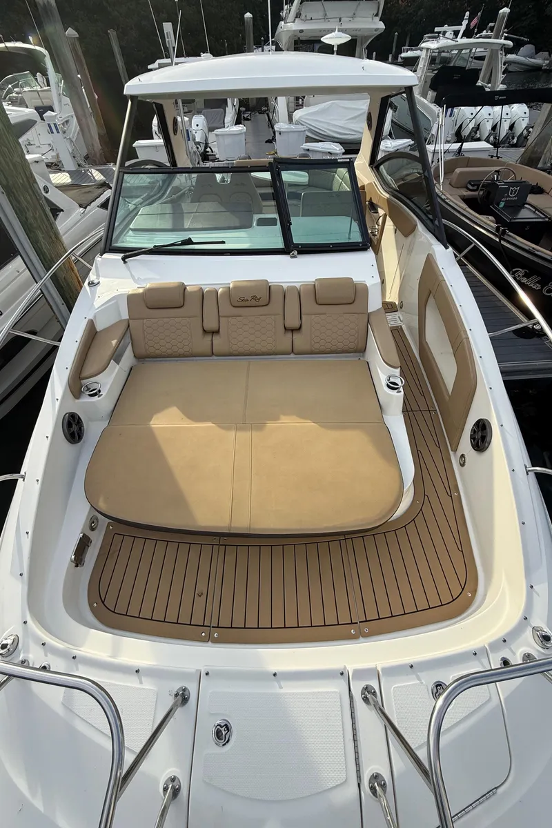 Slide: The Image of 2021 Sea Ray Sundancer 320 Coupe OB with spacious deck and seating area. - 24