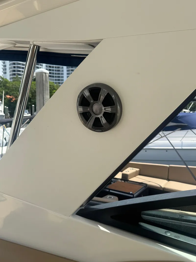 Slide: The Image of 2021 Sea Ray Sundancer 320 Coupe Outboard, exterior speaker detail, docked at marina. - 30