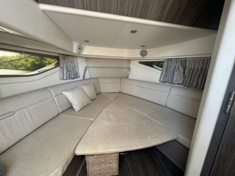 Slide: The Image of 2021 Sea Ray Sundancer 320 Coupe Outboard interior with elegant gray seating and modern design. - 34