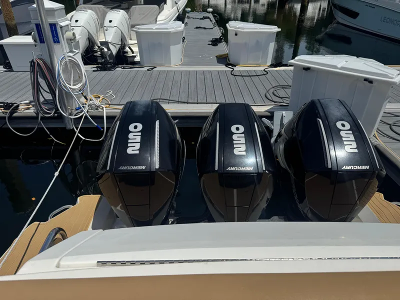 Slide: The Image of 2021 Sea Ray Sundancer 320 Coupe Outboard with triple Mercury engines at dock. - 41