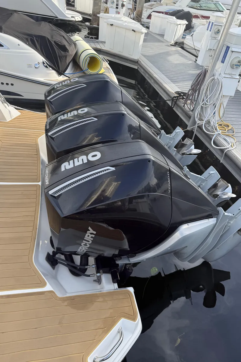 Slide: The Image of 2021 Sea Ray Sundancer 320 Coupe OB with triple outboard engines at dock. - 42