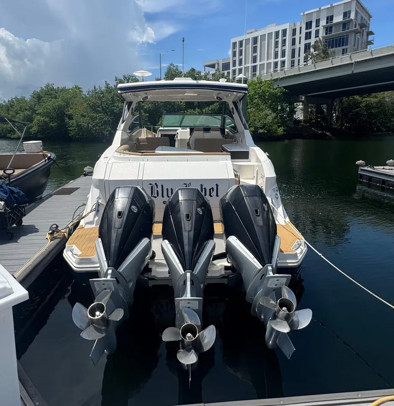 Slide: The Image of 2021 Sea Ray Sundancer 320 Coupe Outboard docked with triple engines. - 43
