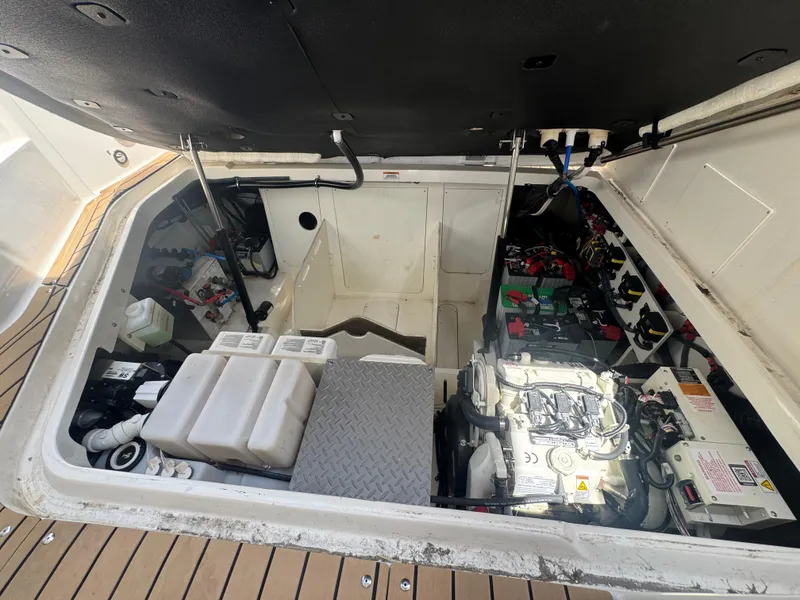 Slide: The Image of Engine compartment of 2021 Sea Ray Sundancer 320 Coupe Outboard, showcasing mechanical components. - 47