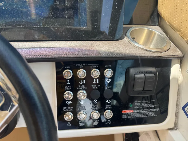 Slide: The Image of Control panel of 2021 Sea Ray Sundancer 320 Coupe Outboard with various switches and buttons. - 6