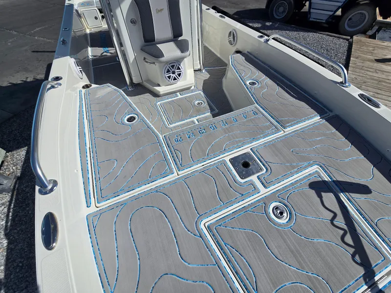 Slide: The Image of 2021 Ranger 2360 Bay boat interior with custom deck padding and seating. - 10