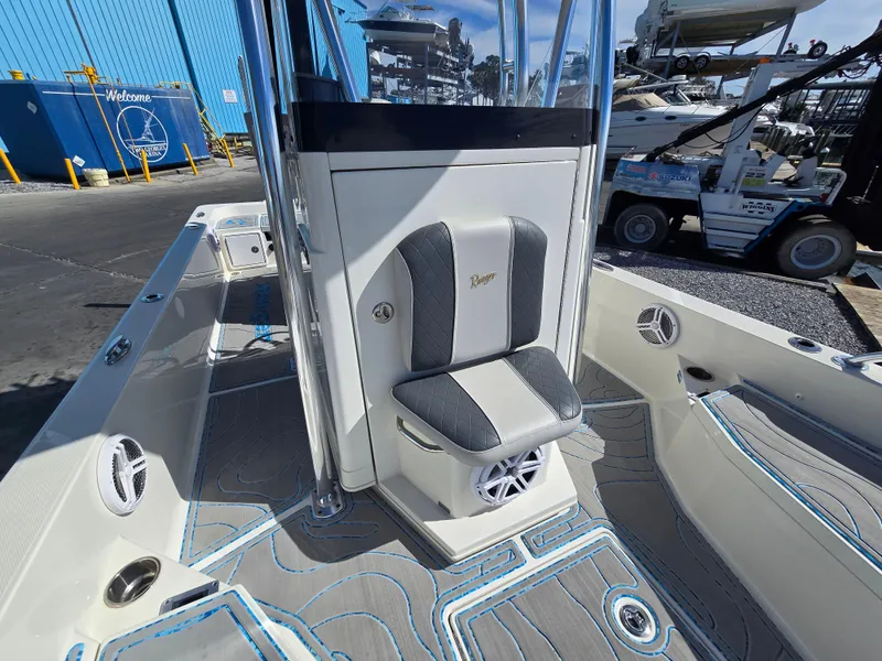 Slide: The Image of 2021 Ranger 2360 Bay boat interior with seating and speaker system. - 11