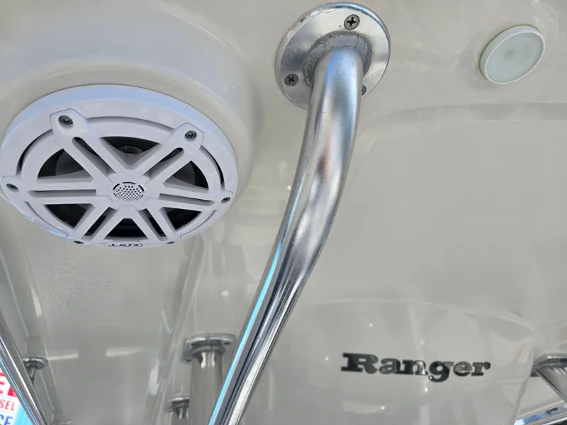 Slide: The Image of 2021 Ranger 2360 Bay boat interior with speaker and metal handle. - 13