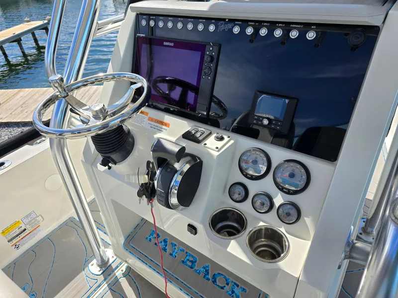Slide: The Image of 2021 Ranger 2360 Bay boat dashboard with steering wheel and navigation instruments. - 15