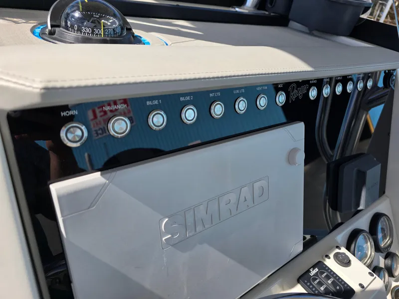 Slide: The Image of Control panel of a 2021 Ranger 2360 Bay boat with Simrad electronics. - 16