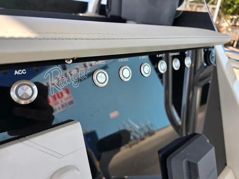 Slide: The Image of Control panel of 2021 Ranger 2360 Bay boat with labeled buttons. - 17