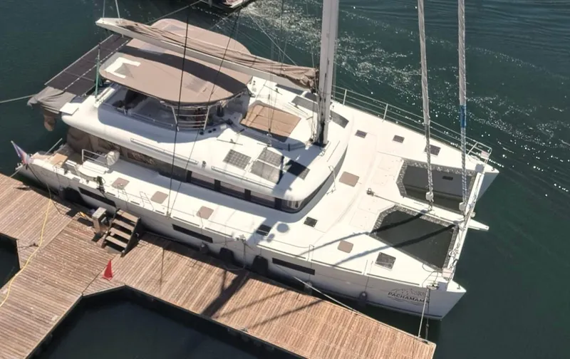 Slide: The Image of 2017 Lagoon 620 catamaran docked at marina, aerial view. - 1