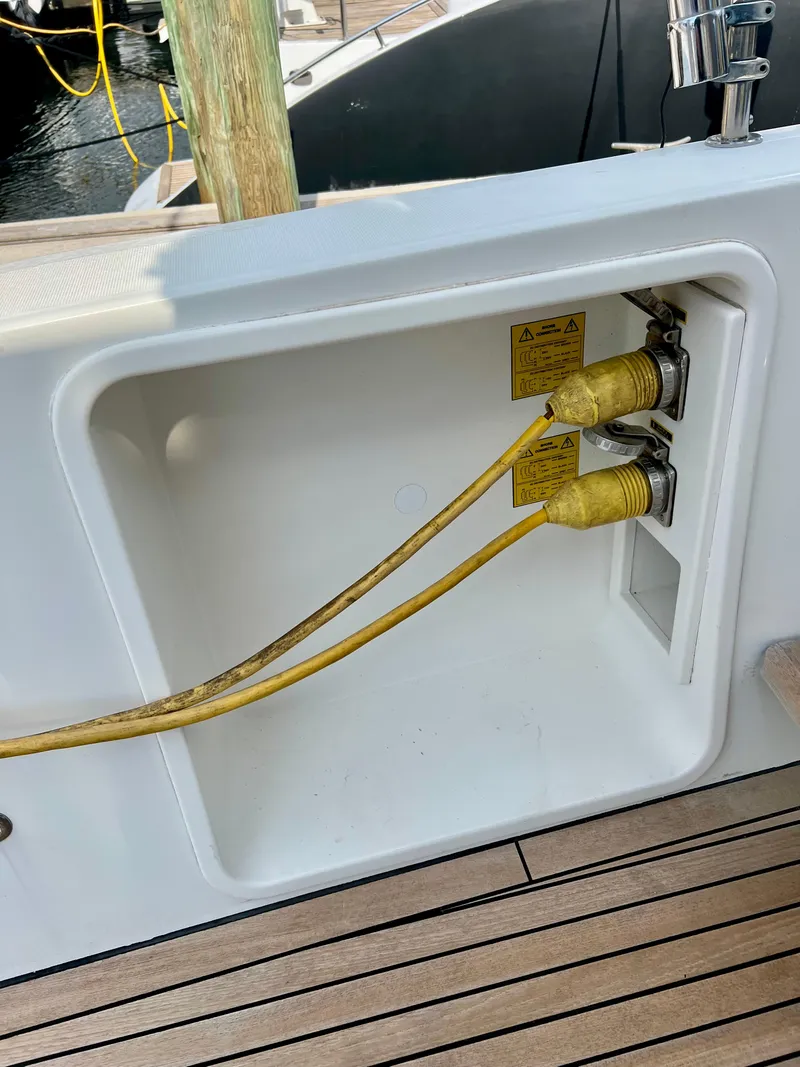 Slide: The Image of Electrical connections on a 2017 Lagoon 620 yacht deck with yellow cables. - 13