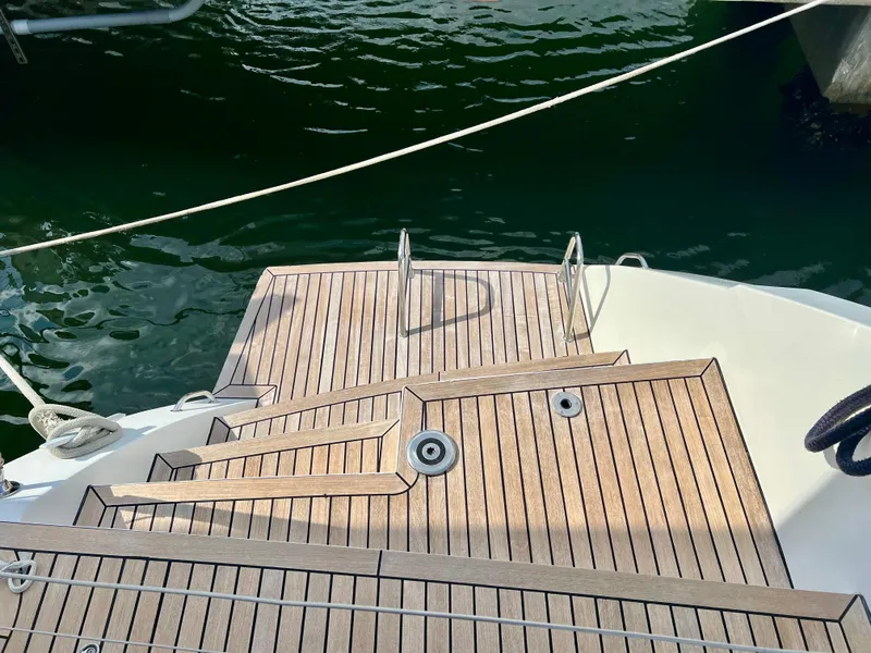 Slide: The Image of Teak deck of 2017 Lagoon 620 yacht with water access ladder. - 14