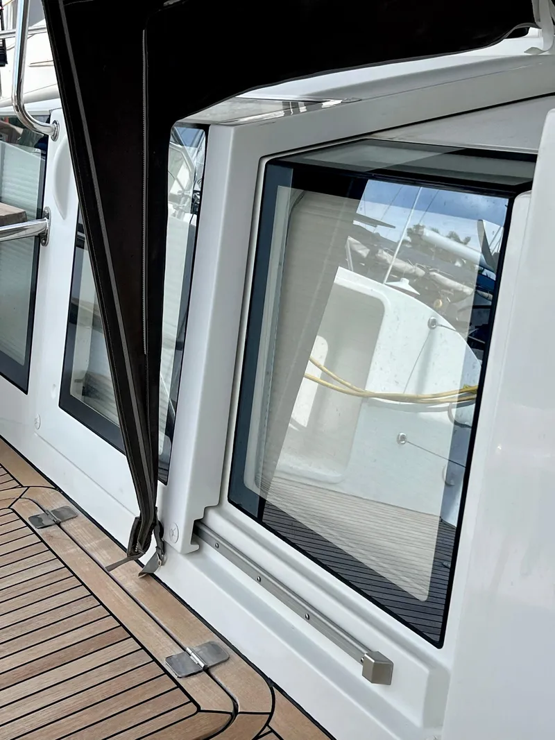 Slide: The Image of 2017 Lagoon 620 yacht window and deck detail with sleek design and modern finish. - 16