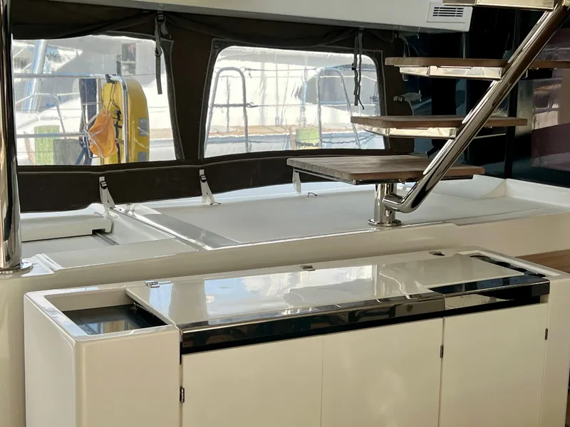 Slide: The Image of Interior of 2017 Lagoon 620 yacht with modern staircase and sleek cabinetry. - 20