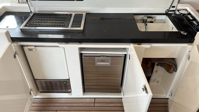 Slide: The Image of Outdoor kitchen on 2017 Lagoon 620 yacht with grill, sink, and storage cabinets. - 21