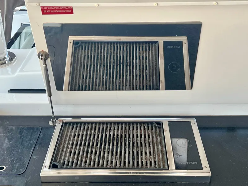Slide: The Image of Built-in grill on 2017 Lagoon 620 yacht, featuring a sleek stainless steel design. - 23