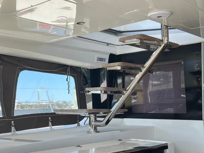 Slide: The Image of Modern interior of 2017 Lagoon 620 yacht with sleek staircase design. - 24