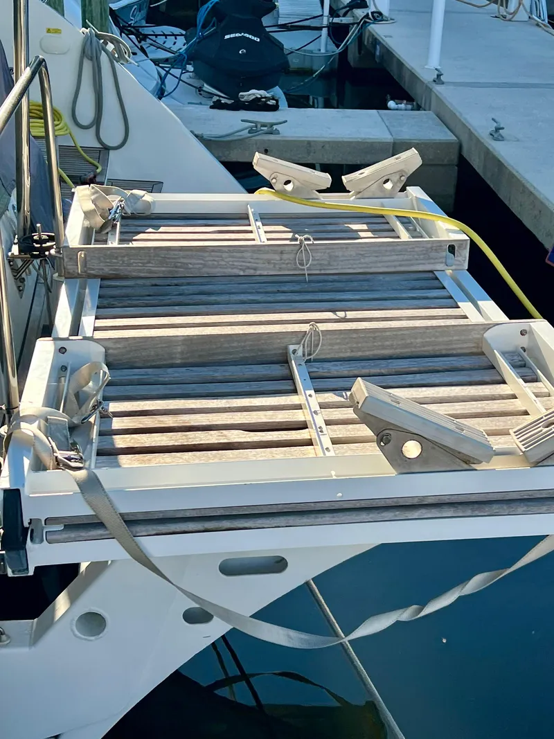 Slide: The Image of Lagoon 620 yacht boarding platform, 2017 model, docked at marina. - 26