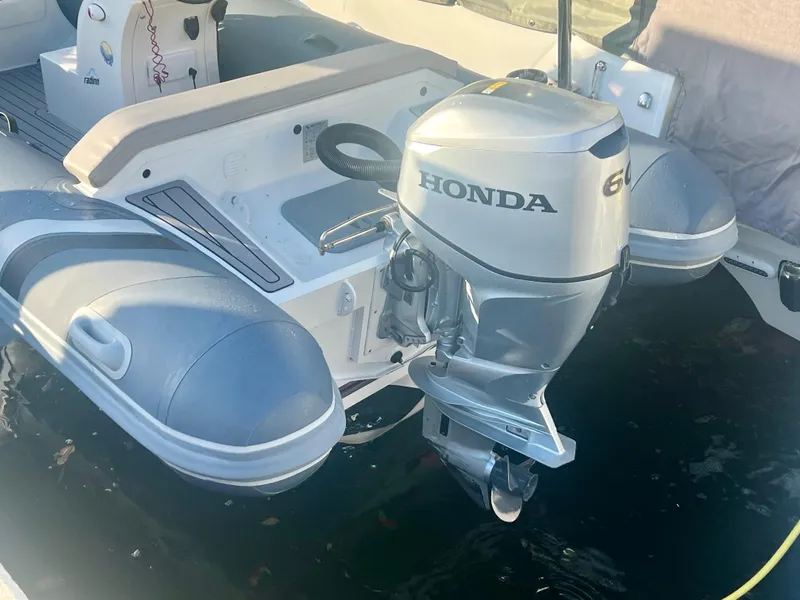 Slide: The Image of Inflatable boat with Honda outboard motor, part of a 2017 Lagoon 620 yacht. - 28