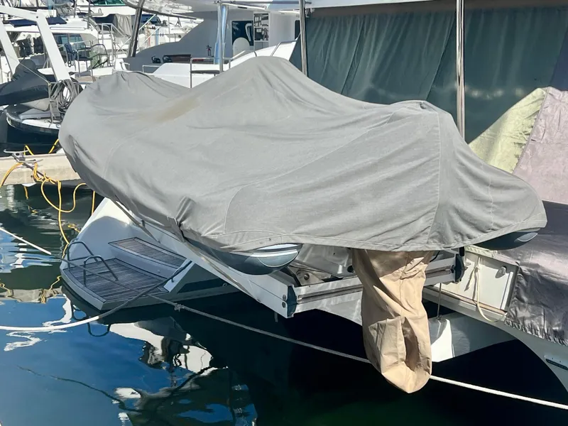 Slide: The Image of Covered Lagoon 620 catamaran docked at marina, 2017 model. - 29
