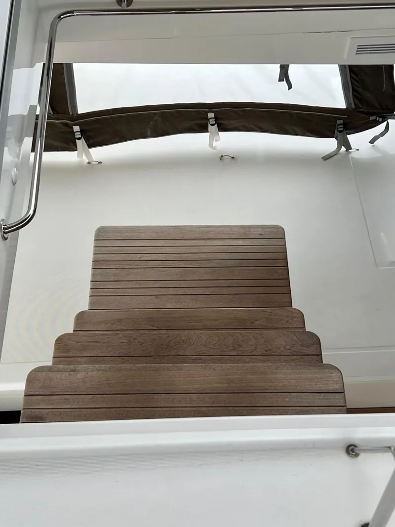 Slide: The Image of Steps on a 2017 Lagoon 620 yacht with wooden finish and railing. - 30