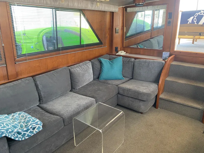 Slide: The Image of Interior of 1988 Californian Sundeck Motoryacht with gray sofa and glass table. - 16