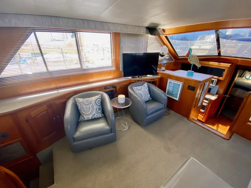Slide: The Image of Interior of 1988 Californian Sundeck Motoryacht with cozy seating and modern decor. - 18