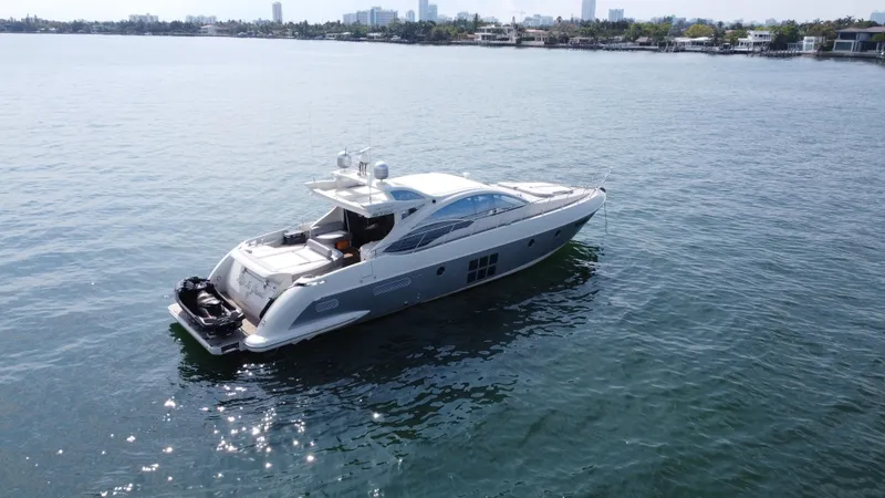 Slide: The Image of 2007 Azimut 62S yacht cruising on calm waters. - 10