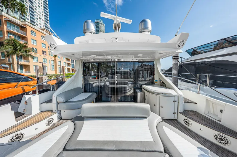 Slide: The Image of 2007 Azimut 62S yacht deck with luxurious seating and modern design. - 21