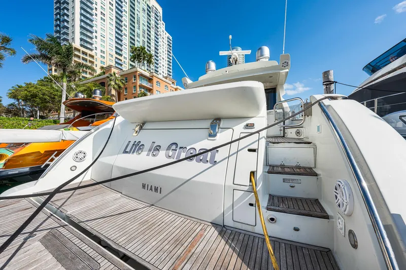 Slide: The Image of 2007 Azimut 62S yacht docked in Miami with "Life is Great" on the stern. - 33
