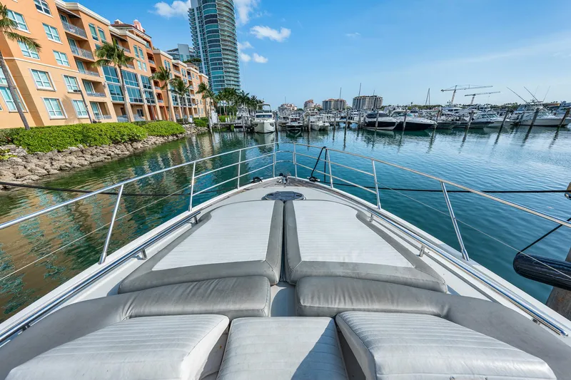 Slide: The Image of Azimut 62S yacht bow view in marina, 2007 model, with waterfront buildings and boats. - 37