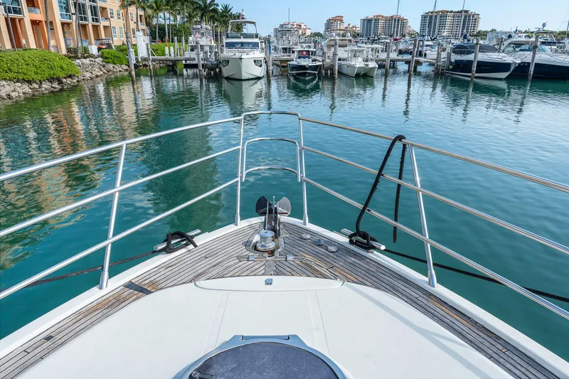 Slide: The Image of Bow view of 2007 Azimut 62S yacht docked in a marina. - 38