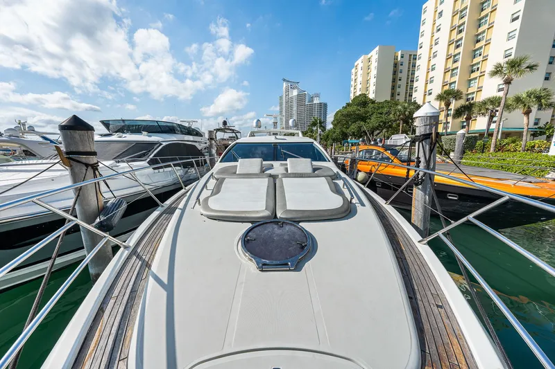 Slide: The Image of 2007 Azimut 62S yacht docked at marina with cityscape background. - 39
